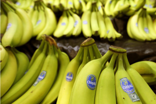Bunches of Chiquita brand bananas are for sale at a grocery store in Zelienople, Pa. on Wednesday, Sept. 10, 2014. On Wednesday, less than a month after rejecting a takeover bid by two Brazilian companies, Chiquita said it will open its books to them. Should Chiquita eventually see eye-to-eye with the investment firm Safra Group and Cutrale Group, a juice company, it could scuttle a proposed tie up with the Irish fruit company Fyffes, a merger that is far along in the process. (AP Photo/Keith Srakocic)