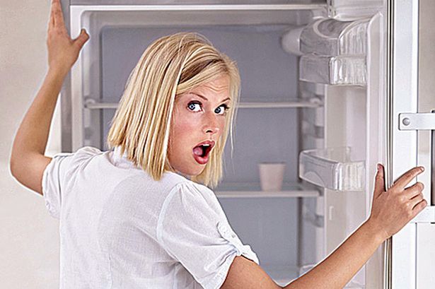 Woman-shocked-by-her-empty-fridge