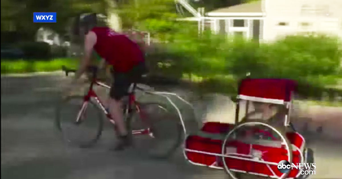 man_runs_triathlong_with_son_who_has_cerebral_palsy_featured