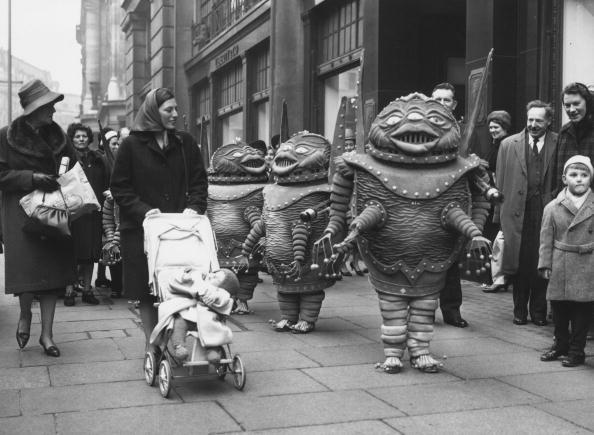 9th January 1964:  Members of Lester's midgets, who play martians in the 'Man In The Moon' with Charlie Drake at the London Palladium, taking a break in costume to the surprise of shoppers in Regents Street.  (Photo by Chris Ware/Keystone Features/Getty Images)