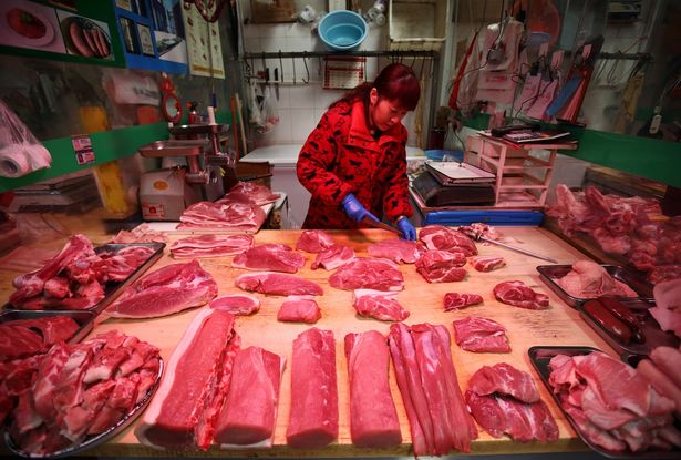 A-meat-stall-at-a-market-in-Beijing