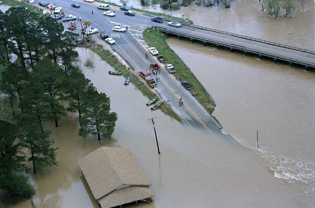 Cars are left stranded as flood waters from the Bogue Chitto River closed this section of road in Franklinton, La., April 8, 1983. Some 200 homes in this area were flooded in the rising waters. It was the worst flood in the lower Mississippi Basin since 1927. (AP Photo/Jack Thornell)