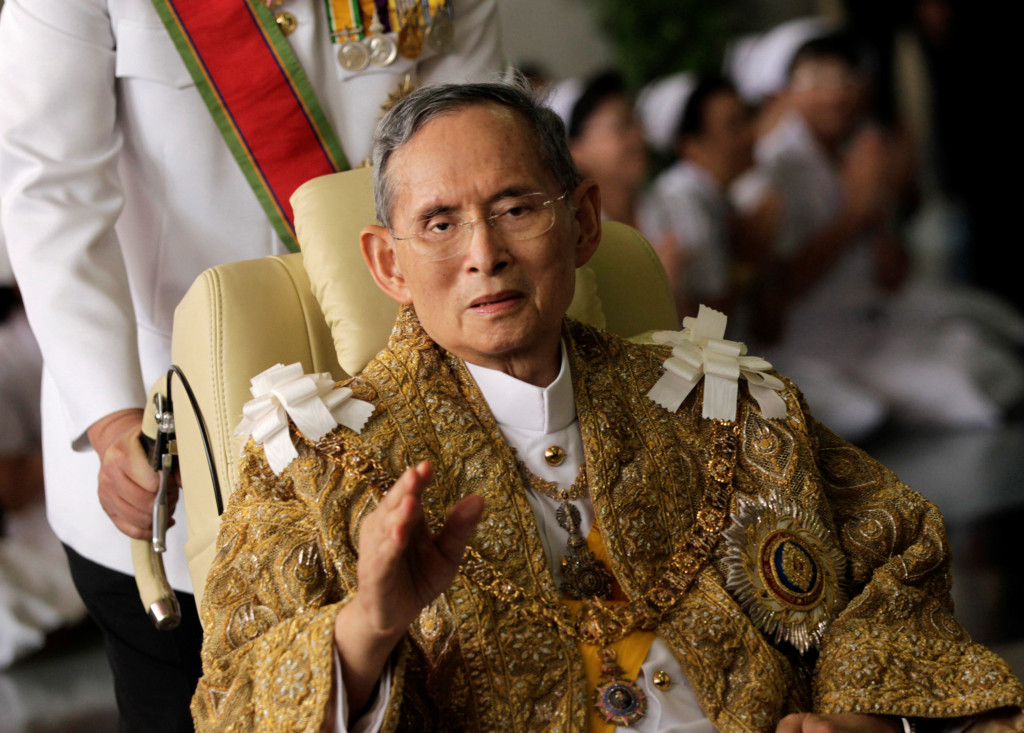 File photo of Thailand's King Bhumibol Adulyadej waving as he returns to Siriraj Hospital after a ceremony at the Grand Palace in Bangkok
