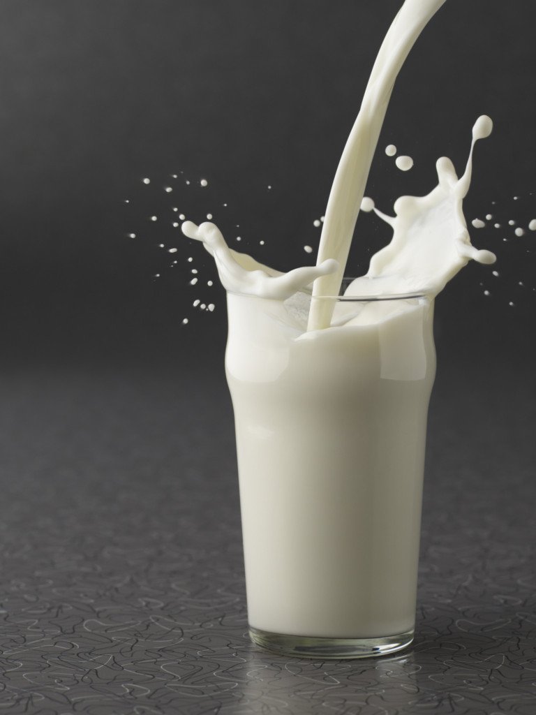 Milk pouring into glass