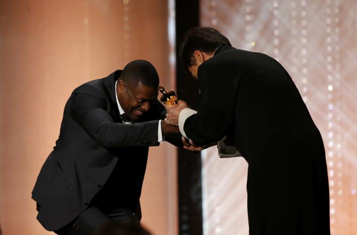 Actor Chris Tucker present Jackie Chan (R) with his Honorary Award at the 8th Annual Governors Awards in Los Angeles, California, U.S., November 12, 2016.  REUTERS/Mario Anzuoni